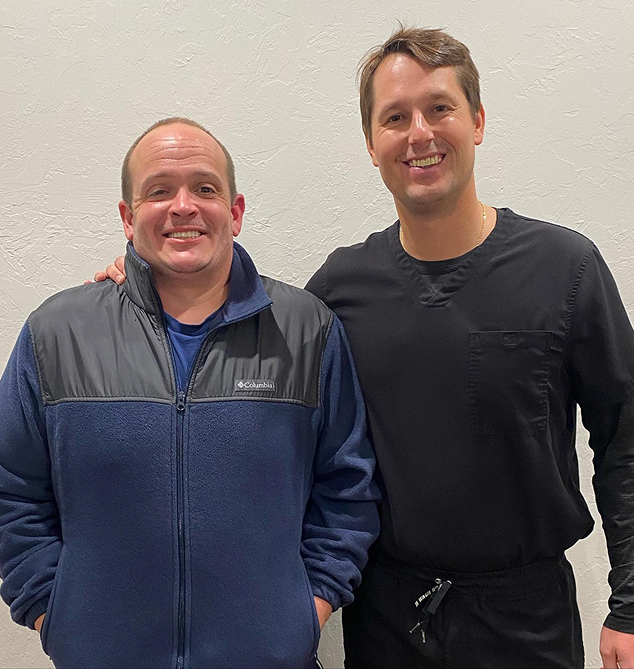 Dr David Lawrence with his patient after the dental implant procedure at Oklahoma Implant and Sedation dentistry in Oklahoma City, OK
