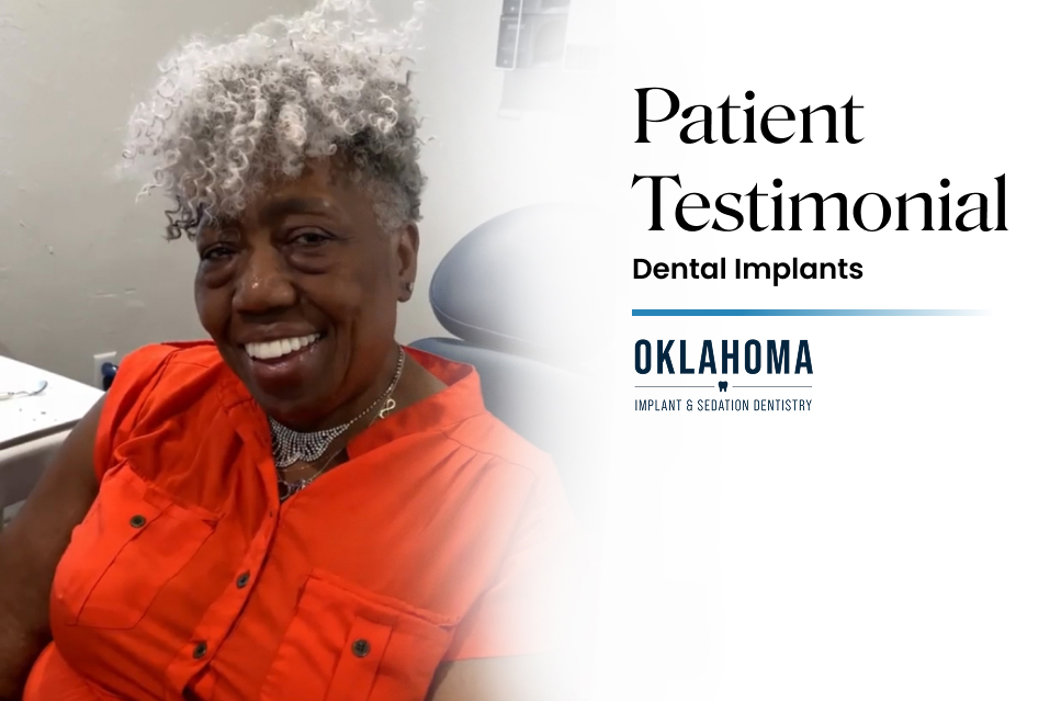 Smiling patient in orange shirt sharing a testimonial about dental implants at Warwick Dental, Oklahoma City, highlighting positive experiences and patient satisfaction.